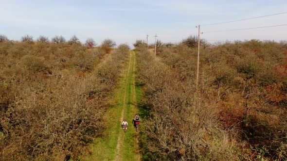 Aerial View Cute Girls Having Ride Together in Rural Landscape 