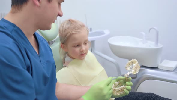 Child Girl Check Up and Dental Exam at Dentist