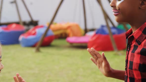 Friends with face paint playing with each other 4k alt