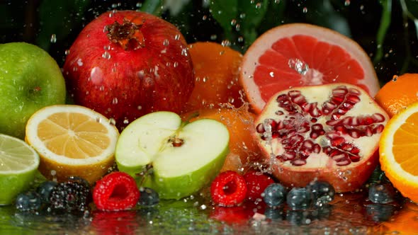 Super Slow Motion Shot of Pouring Water on Variation of Fruits at 1000Fps alt