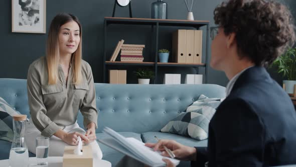 Young Woman Sharing Emotions with Therapist Discussing Life Problems Smiling alt