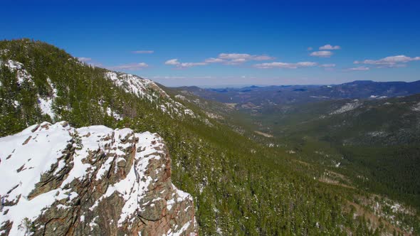 Aerial Drone Shot Flying Over Gorgeous Lush Green Wide Open Alpine Rocky Mountains Valley During Sun alt