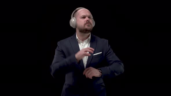 Bald Bearded Handsome Businessman, Man in Blue Jacket and White Shirt in Headphones, Rejoices in alt