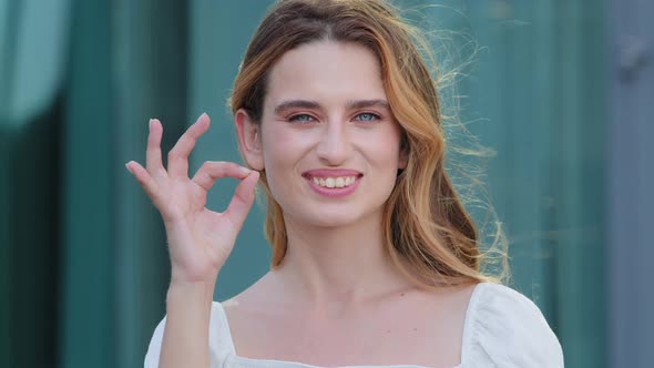 Happy European Caucasian Woman Gesturing Ok Smiling with White Teeth Looking at Camera Pretty alt