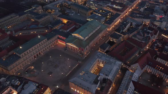 Scenic Aerial View of Bavarian State Opera Building at Night with Empty Square in Front Due To alt