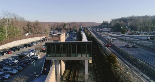 Moving along the train track from one end of the station to the other alt