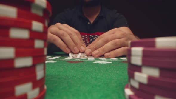 Male Player Betting All Chips in While Playing in Casino Close Up