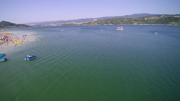 Lake view from the air. Holidays. Ships, tourists, people