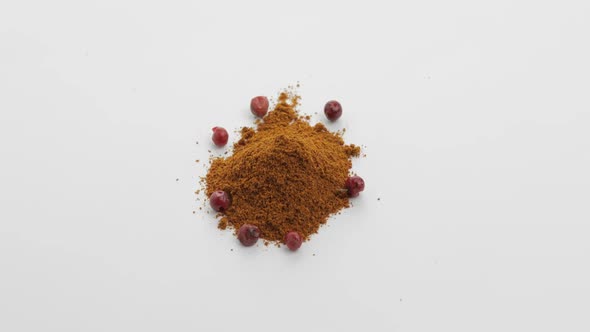 Red Pepper Powder Rotation. Macro Shot Against a White Background alt