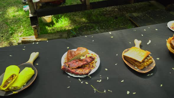 Plate of grilled ribs with bread and salad. Summer barbecue. Enjoying the view of grilled ribs alt