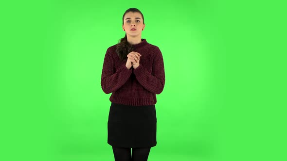 Woman Looking at Camera with Anticipation, Then Very Upset. Green Screen alt