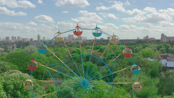 Beautiful Ferris Wheel in the Green Area of the City Park
