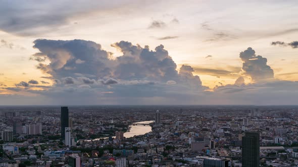 Bangkok city center and Chao Phraya River, with dramatic cloud and sky, day to night - Time Lapse