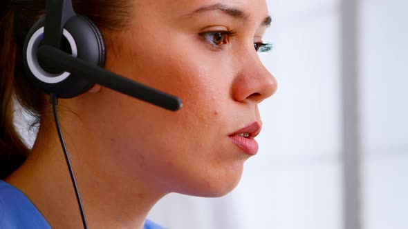 Close Up of Medical Operator with Headphone Consulting Patients alt