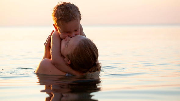 loving mother hugging with