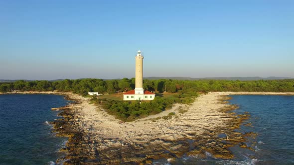Aerial view of a lighthouse, Croatia with landscape in the background alt