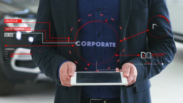 Man with a Futuristic Screen with the Word Corporate. The Concept of the Future Interface on a