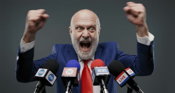 Cheerful politician celebrating his victory, he is shouting with raised fists