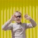 Boy in Sunglasses Gesticulates Moves His Hands on Bright Sunny Day - VideoHive Item for Sale