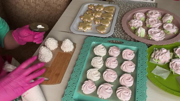 A Woman Prepares Marshmallow Cones. Ready Made Sweets Are Laid Out On Trays. Close Up Shot. alt