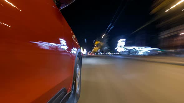Drivelapse From Side of Car Moving on a Night Avenue in City Timelapse Hyperlapse alt