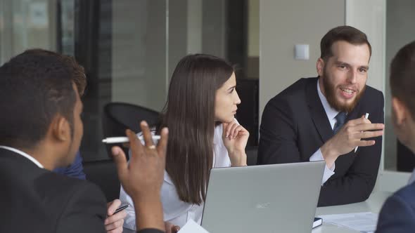 Young Business Team at Work. Bright Contemporary Small Creative Business. alt