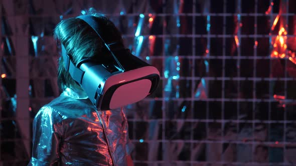 Boy Child in a Silver Shirt and Glasses Virtual Reality Playing a Game alt