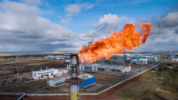 The Pipe at the Chemical Plant Burns the Residues of Natural Gas alt