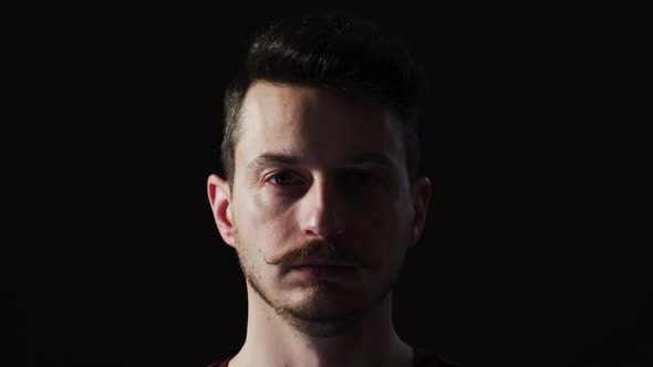 Close up of a man chewing gum alt