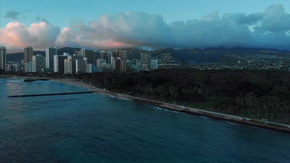 Aerial drone footage of Honolulu, Hawaii. Beautiful real estate, buildings in the city. Palm trees alt