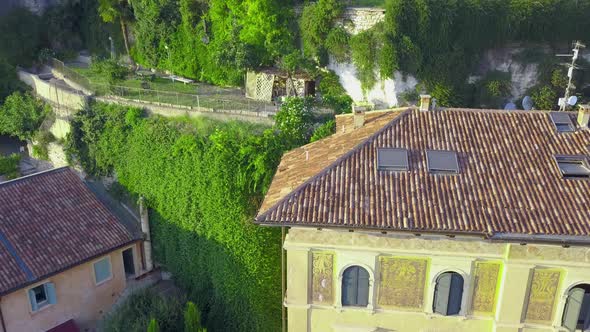 Panorama of Verona historical city centre, bridges across Adige river.Buildings with red tiled roofs alt