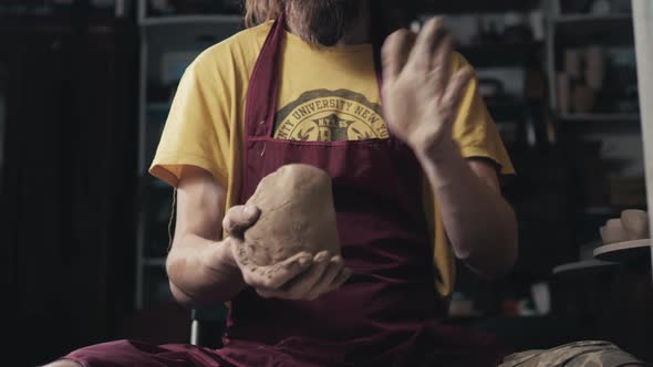 Serious Woman Working at Pottery Wheel in Studio Prepare Clay to Make Plate to Restaurant alt