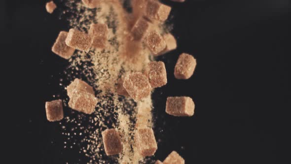 Super Slow Motion Drop Pieces of Cane Sugar alt