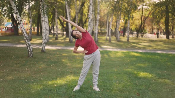 Elderly Woman Stretching at the Park alt