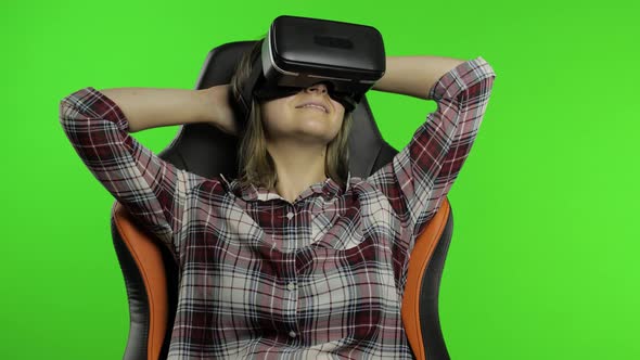 Young Woman Using VR Headset Helmet To Play Game. Watching Virtual Reality 3d 360 Video. Chroma Key alt