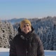 Portrait of a Young Funny Woman on a Winter Day at Mountain, Looking at Camera, Slow Motion - VideoHive Item for Sale