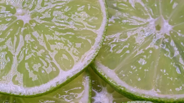 Macro Shot of Natural Fresh Lime Slices Rotating