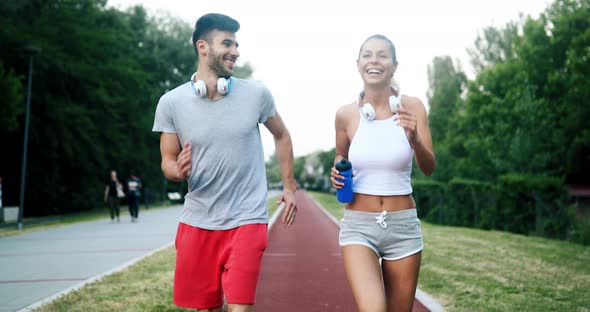 Beautiful Couple Jogging and Fitness Training Outdoor