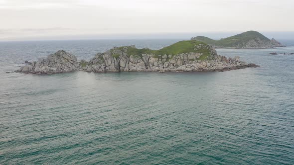 Rocky Islands in Triozerye Bay at Sunset alt