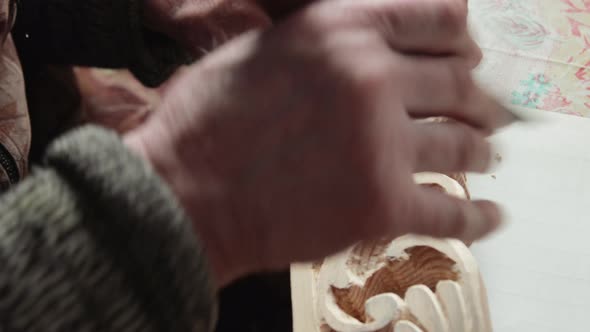 Closeup shoot of a woodcarver at work