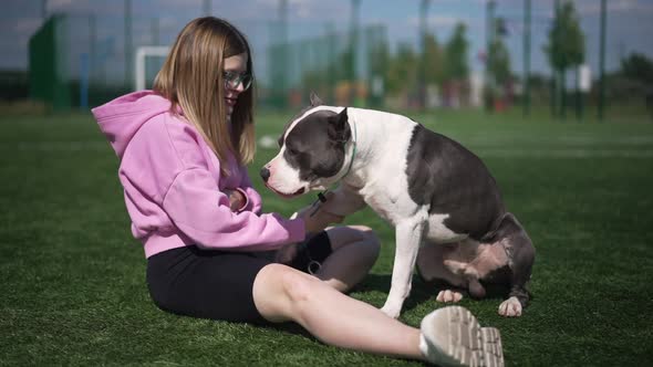 Side View Happy Dog Giving Paw to Woman in Slow Motion Playing with Owner Outdoors alt