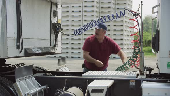 Truck driver hooking up trailer.  Fully released for commercial use.