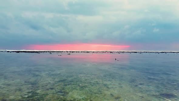 Magical view of mother nature showing backwaters at the seashore, under cloudy pink sky. alt