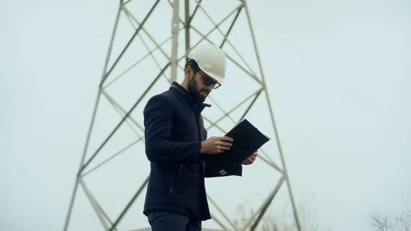 Electrical Engineer Check High Voltage Pole. Power Generation Energy Infrastructure. Maintenance. alt