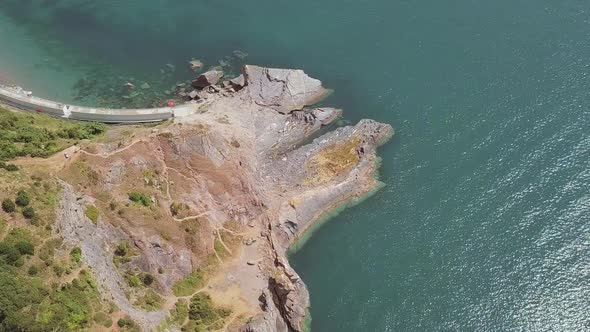 Aerial Top Down shot revealing the English Channel from a Cliffside. alt
