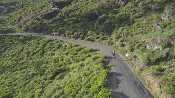 Green Tea Plantations and Local Man Running Along Serpentine alt