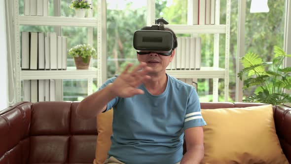 Asian elderly man with VR glasses, concept of adaptation to technology