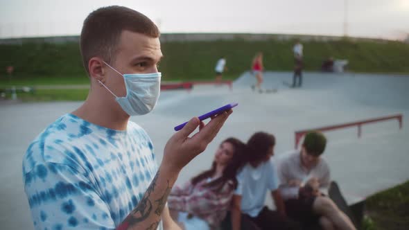 Stylish Man Wearing Safety Coronavirus Medical Mask Using Voice Recognition Audio Message Ai Control alt