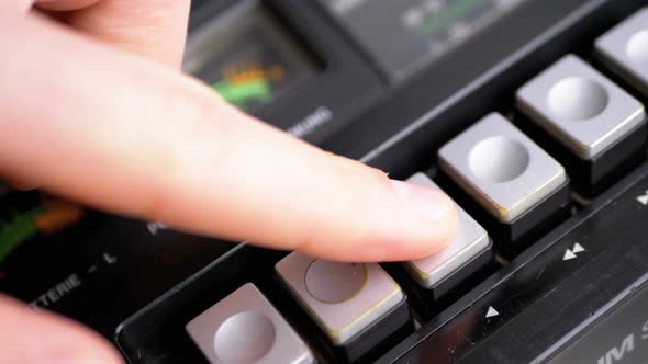 Pushing Play Button on a Vintage Tape Recorder. Transistor Retro Radio alt