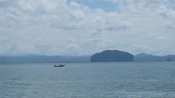 A long tail boat sailing in the sea